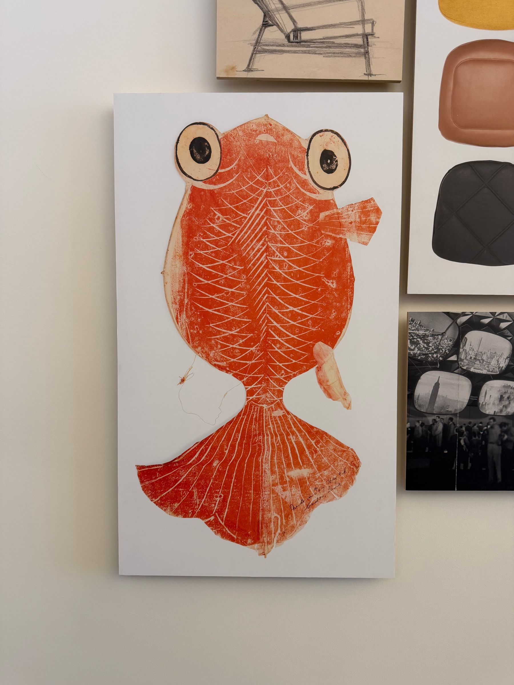A painting of a goldfish, in the lobby of the Eames Archives.
